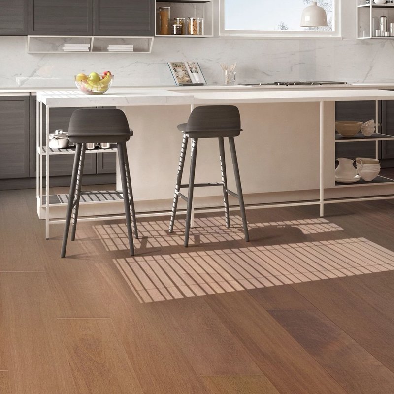 white table and gray chair on brown hardwood floor by Pat Smith’s Flooring in Louisville, KY